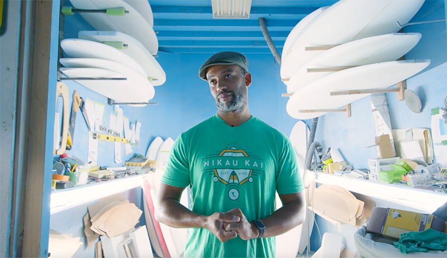 Ryan Harris stands in his shaping bay at Earth Technologies
