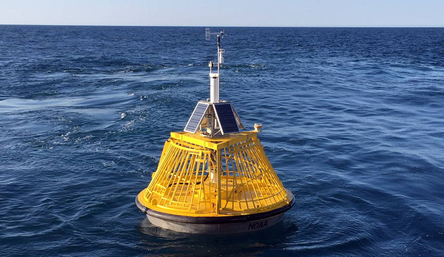 A buoy that gives wave height and wind informations sits in the ocean