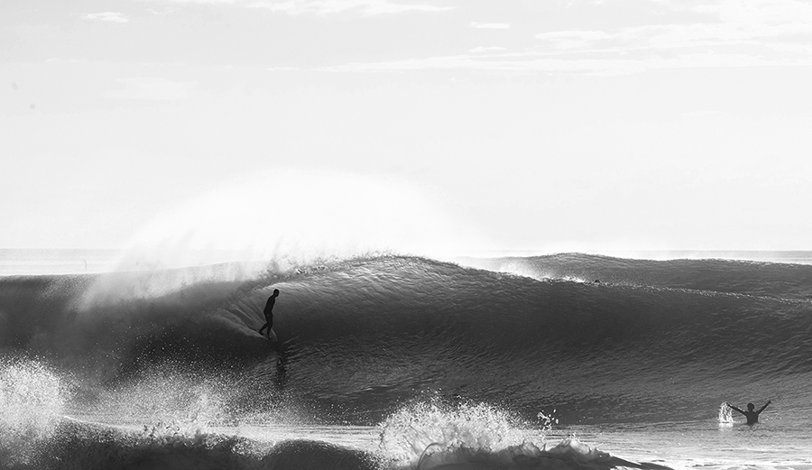 A surfer gets barreled at Pipeline