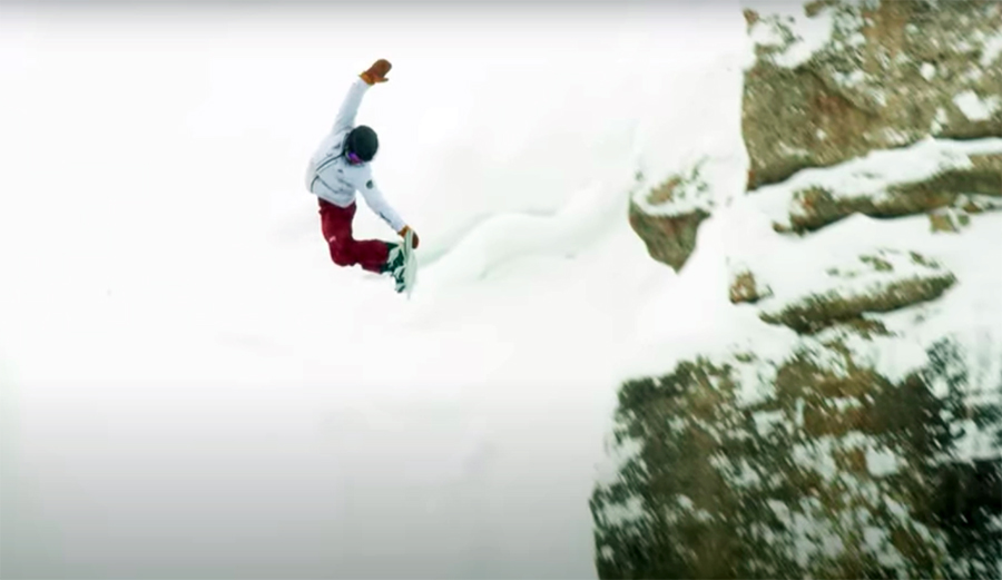 A snowboarder throws a method off Corbet's at Jackson Hole