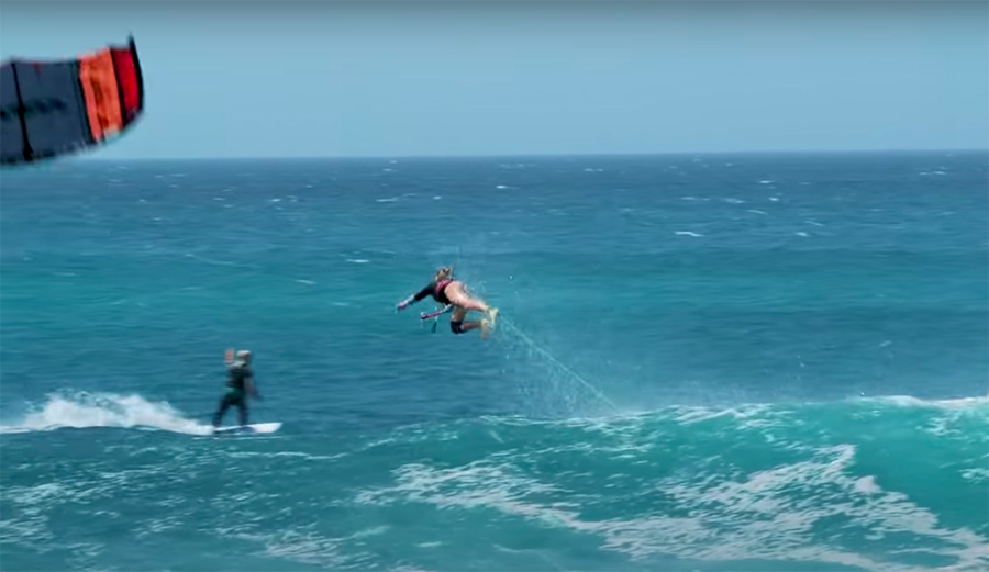 A kite surfer wipes out hard on a wave