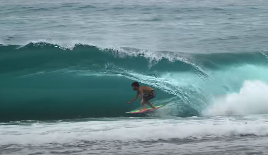 Mason Ho surfing in barrels on reef