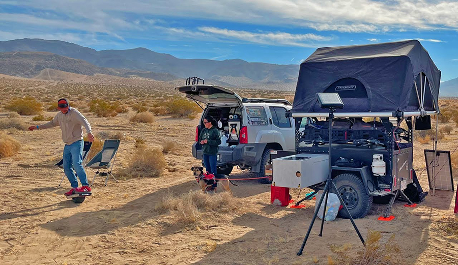 A nomadic couple and their camping setup