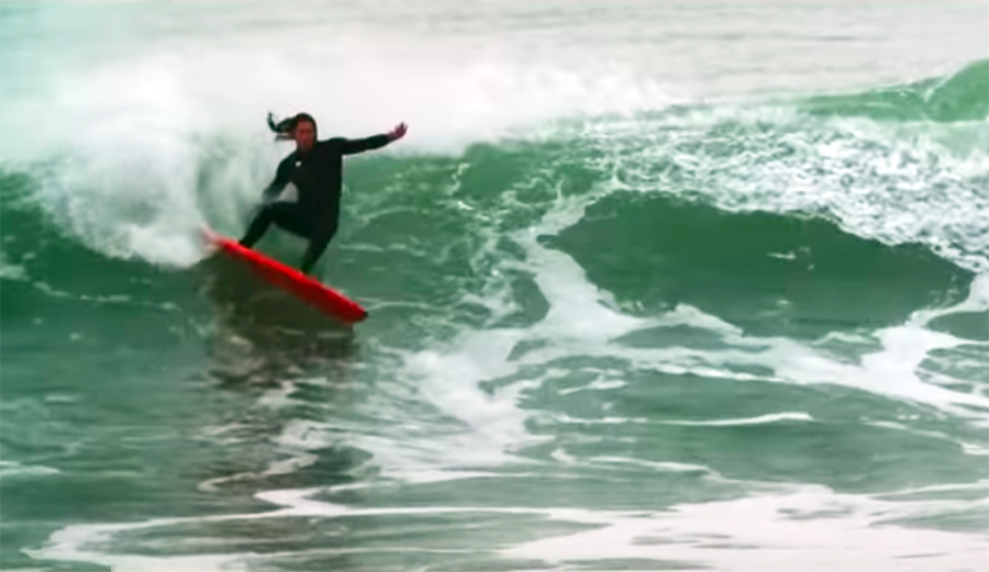 Darhsan Gooch makes a turn on a wave
