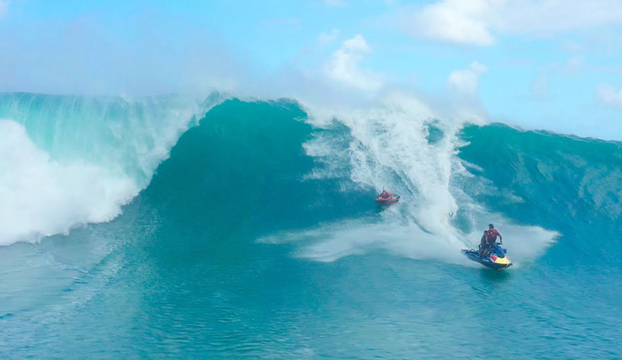 Jamie O'Brien on big wave with inflatable raft