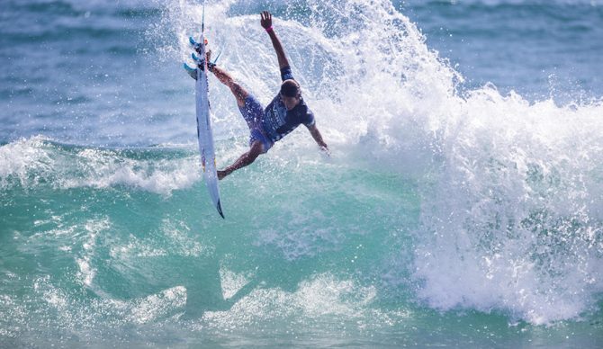 Kanoa Igarashi throws an air on a wave