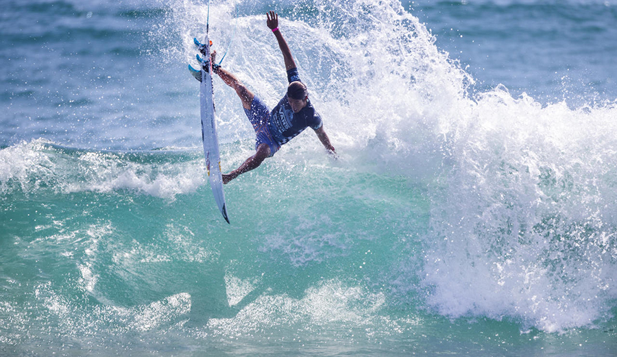 Kanoa Igarashi throws an air on a wave