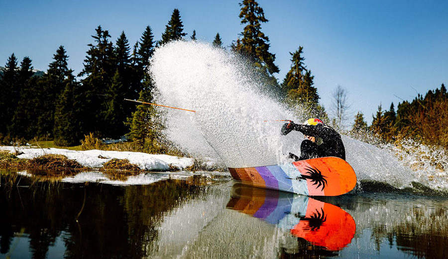 Nikolas Plytas using a snowboard to wakeboard