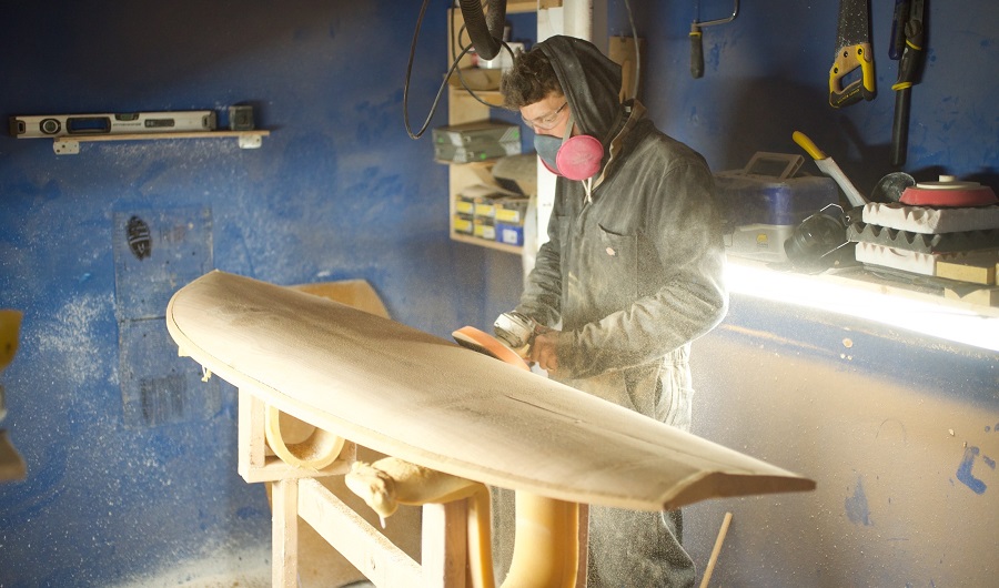 ryan lynch of timber surf co shaping a board