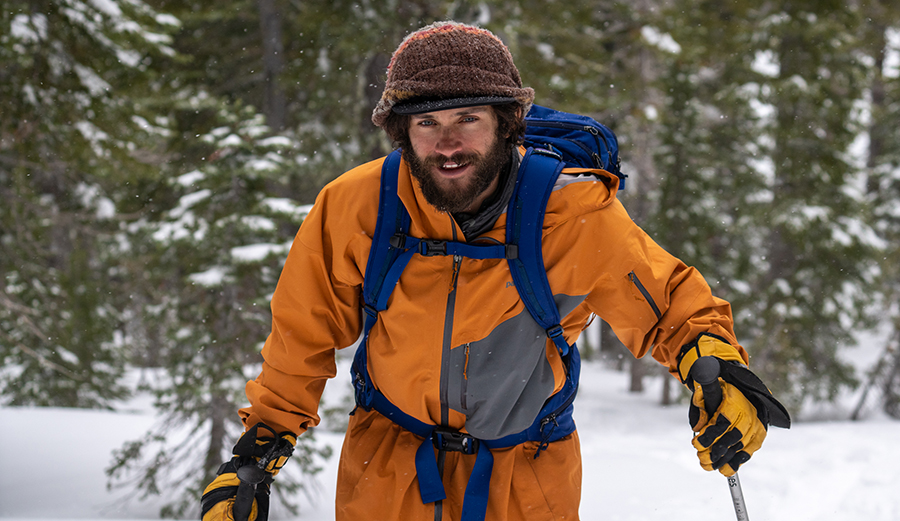 Nick Russell hikes on his splitboard in the backcountry