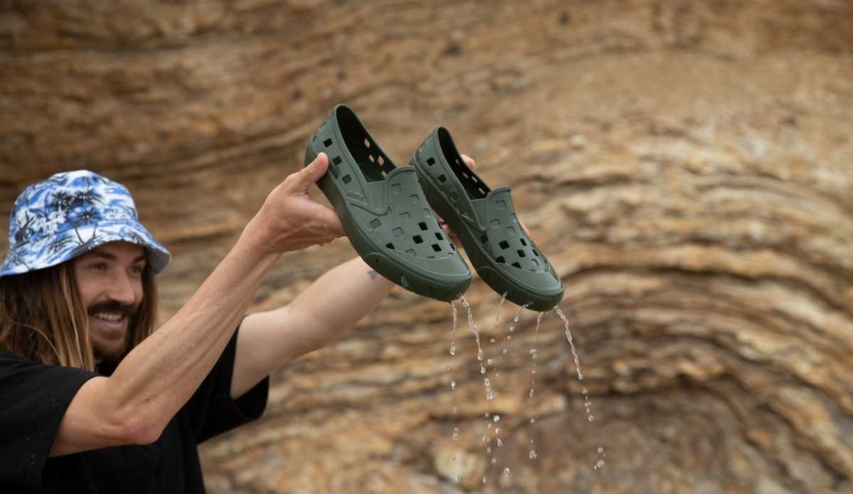 Dylan Graves Holds Vans Trek Slip-Ons