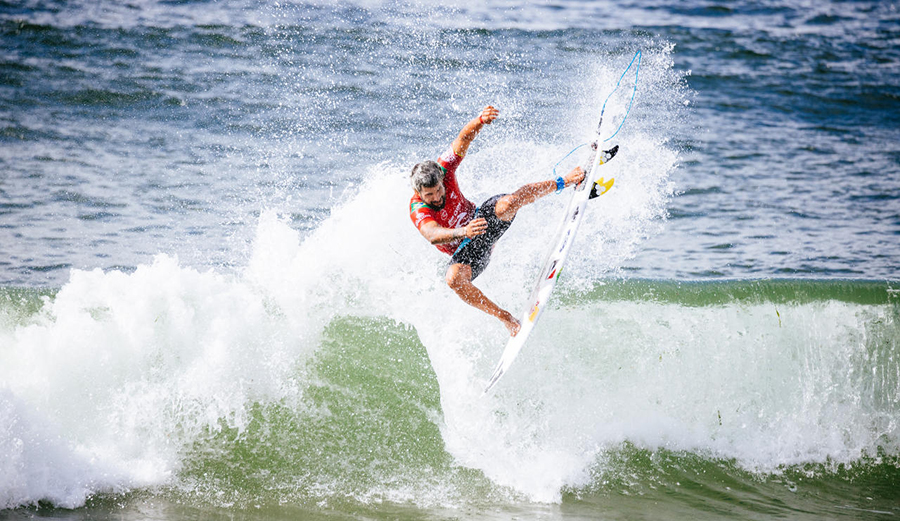 Italo Ferreira goes to the air on a wave in Newcastle, NSW, Australia