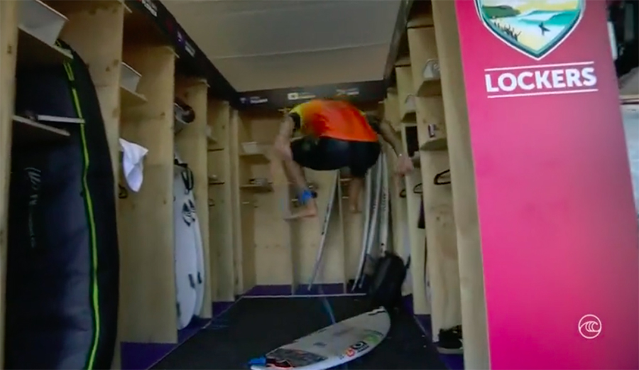 Italo Ferreira jumps on his surfboard and breaks it