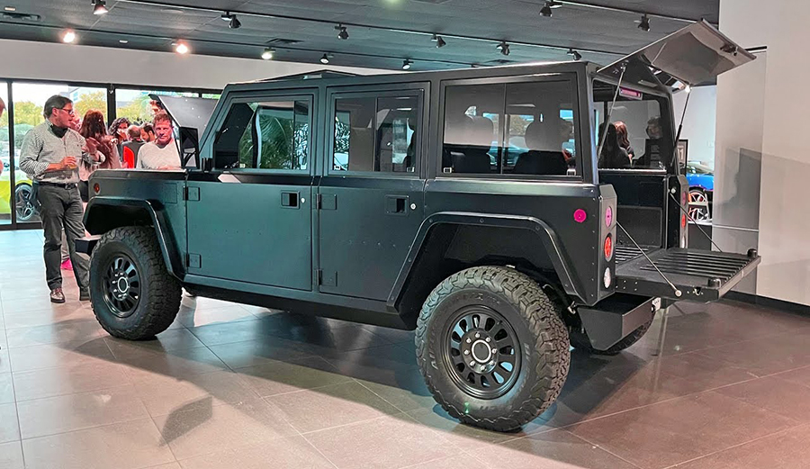 A 4x4 electric SUV on the showroom floor
