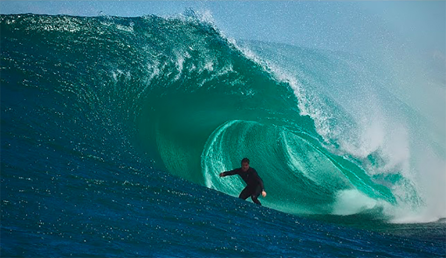 A surfer rides a dangerous barrel in Australia