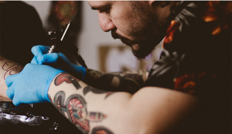 Tattoo Artist tattooing