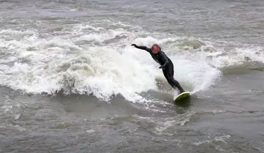 Ben Gravy surfs a river wave in Vermont