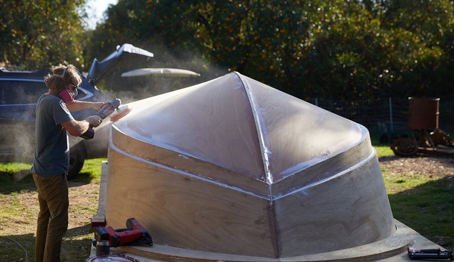 jay nelson sanding a boat