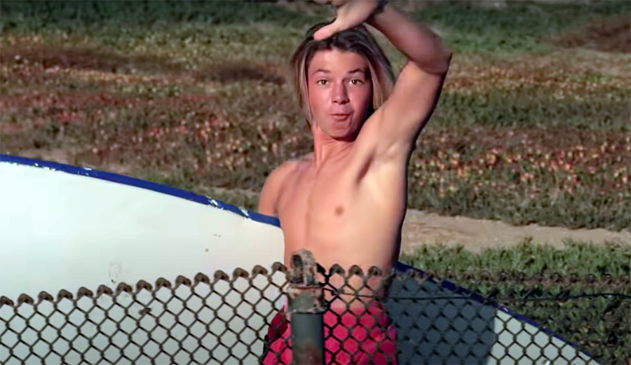 A grom goes searching for waves