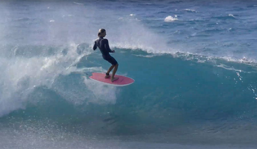 Tosh Tudor surfing