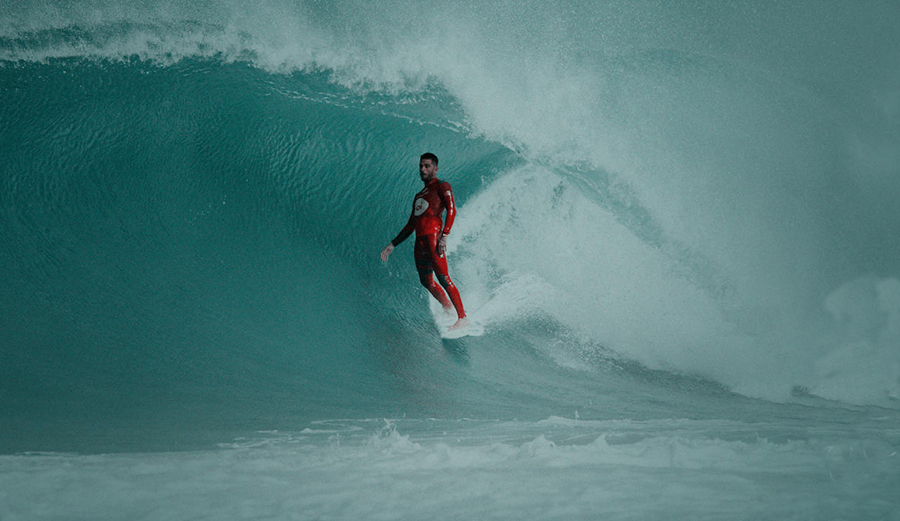 Filipe Toledo rides a barrel