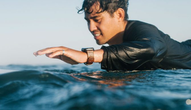 Apple Watch on surfer focused on strap.