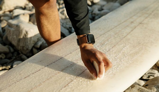 Apple Watch while putting wax on board.