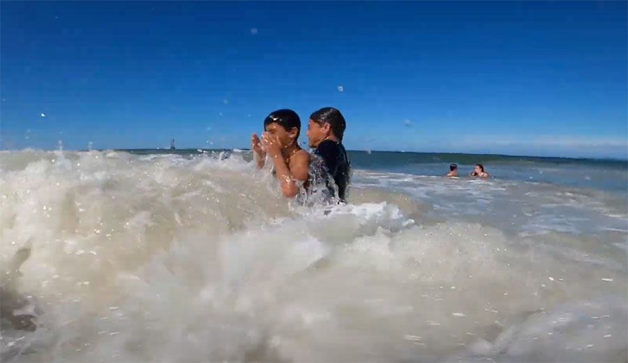 Ben Gravy and Kalani Robb with swimmer