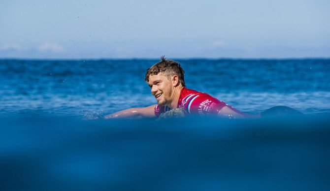 John John Florence paddling out to a WSL event