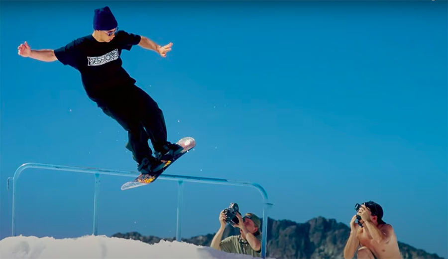 Jamie Lynn rides a rail on a sowboard