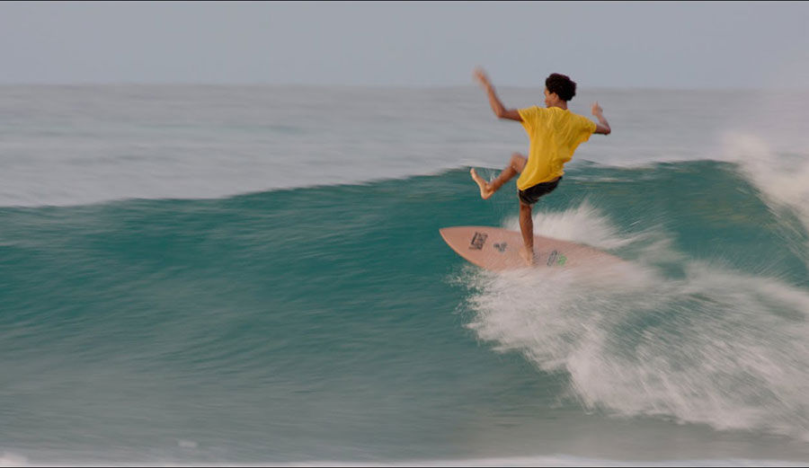 Mikey February surfing