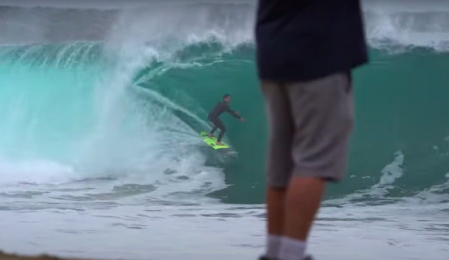 a surfer in a barrel at the wedge