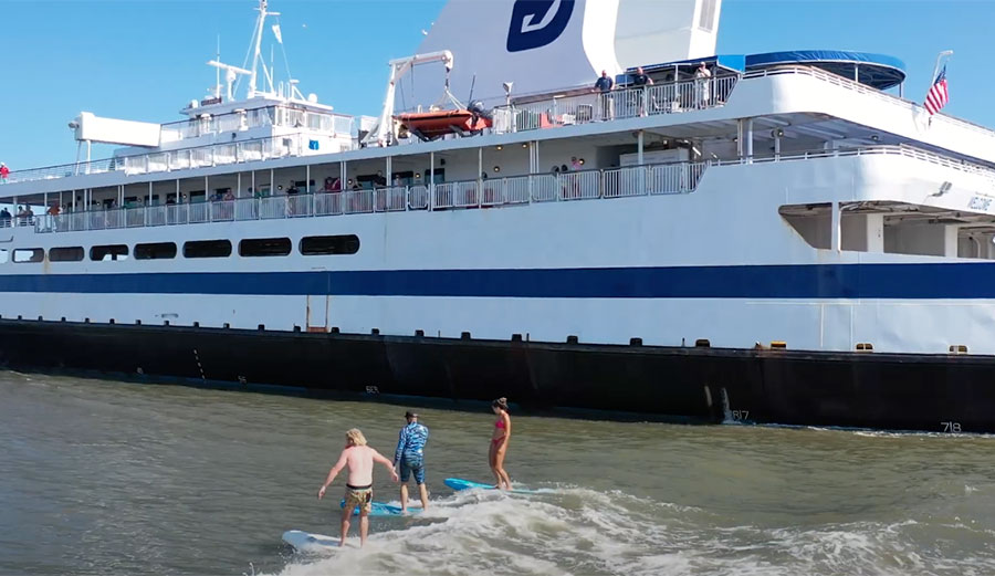 Jamie O'Brien, Ben Gravy, and Tina Cohen ferry surfing in New Jersey