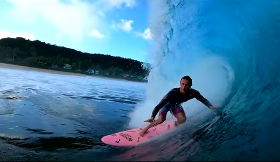 A surfer gets a barrel at Pipeline on the North Shore