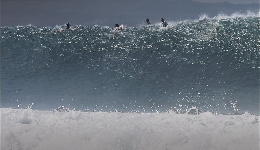 A giant set wave runs through Keramas in Bali