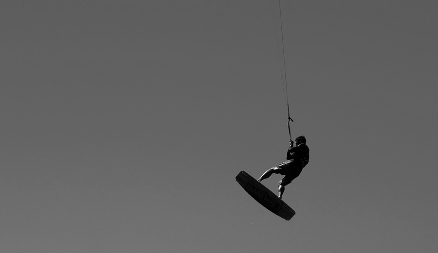 A kitesurfer gets air