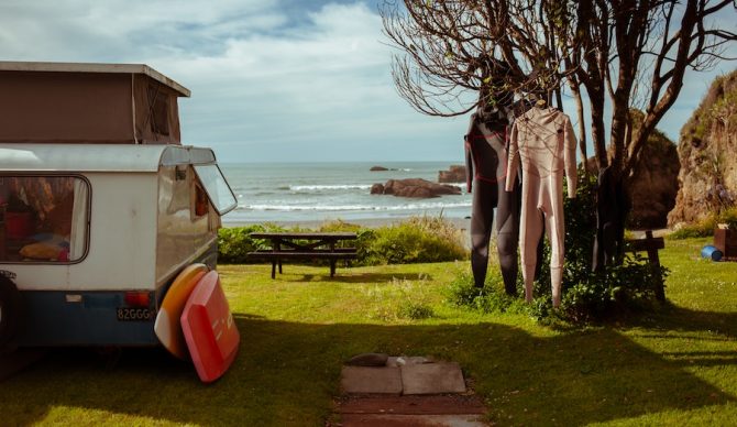wetsuits hanging at a campsite