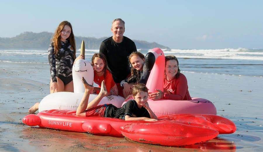 Kathy Thomas with her family on the beach for Salt + Snow