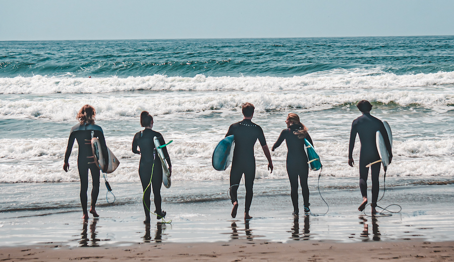 surfers walking into the ocean at Ocean Beach san francisco