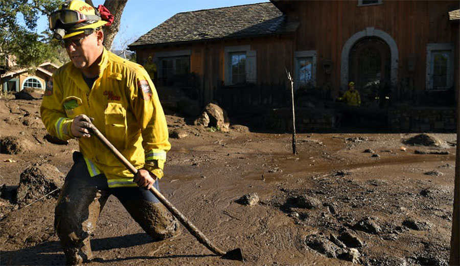 firefighter checking mudslide home