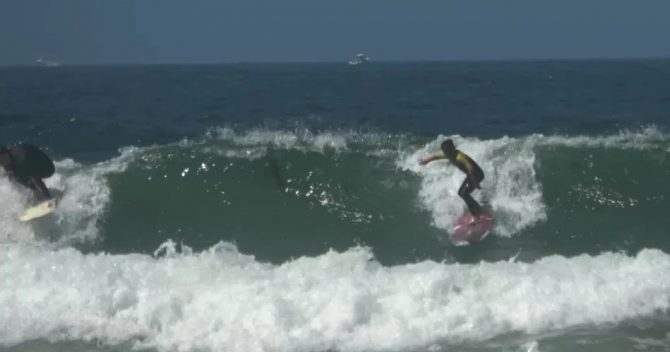 jake coaching grom surfing