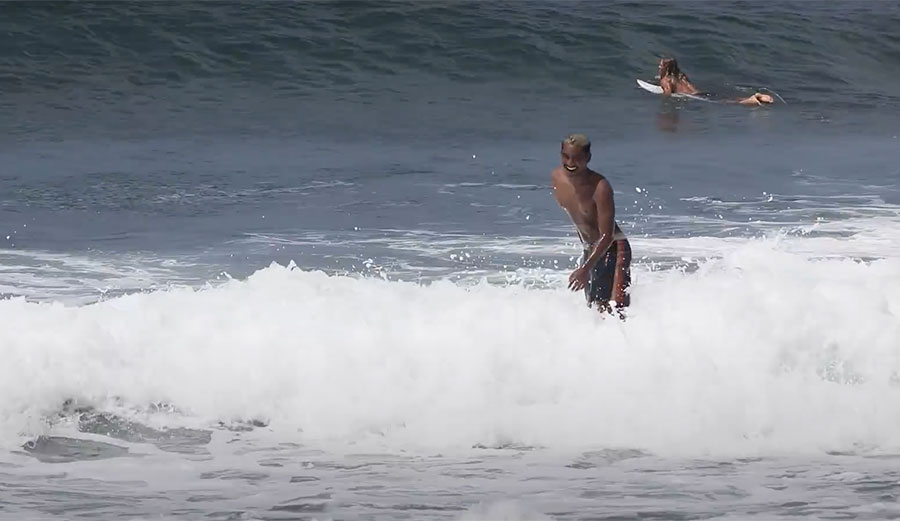 Ketut Agus surfing in Bali