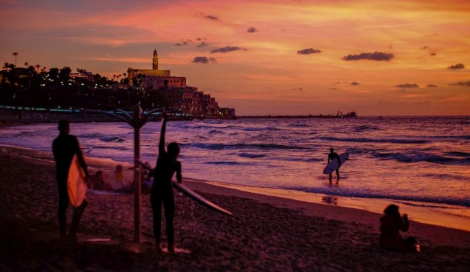 surfers showering in israel