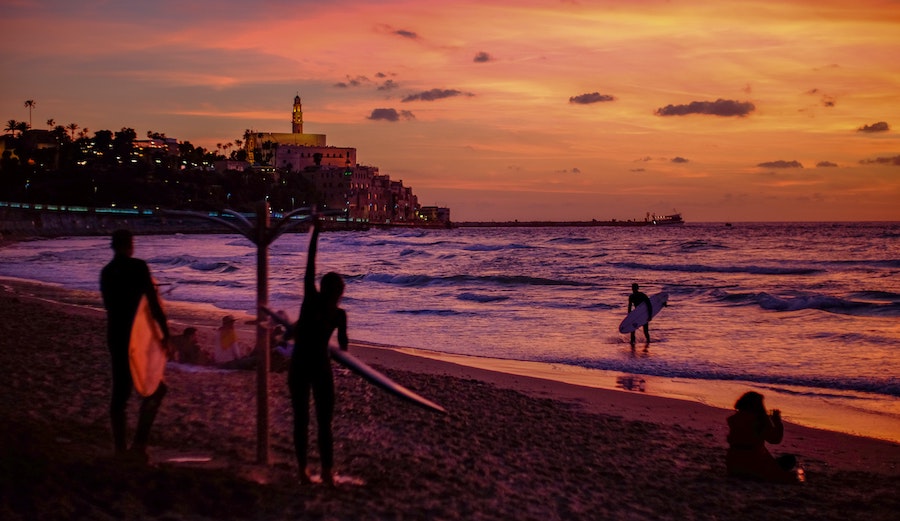 surfers showering in israel