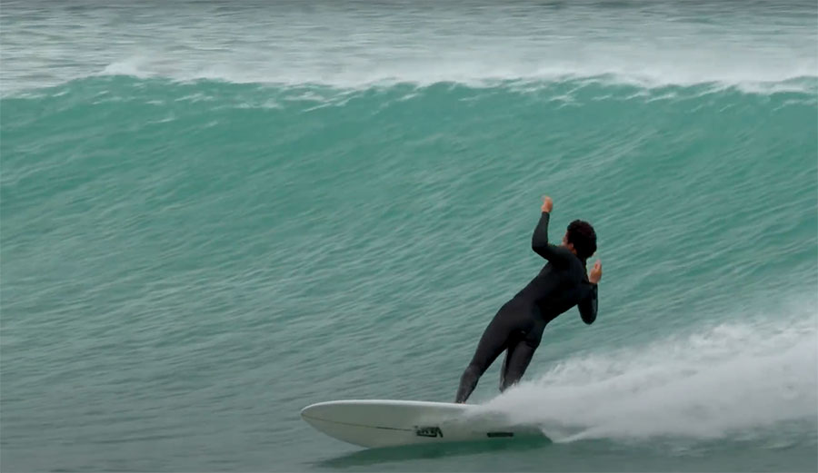 Mikey February surfing