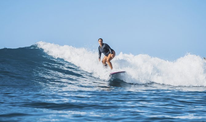 Curvy Surfer Girl Surfing