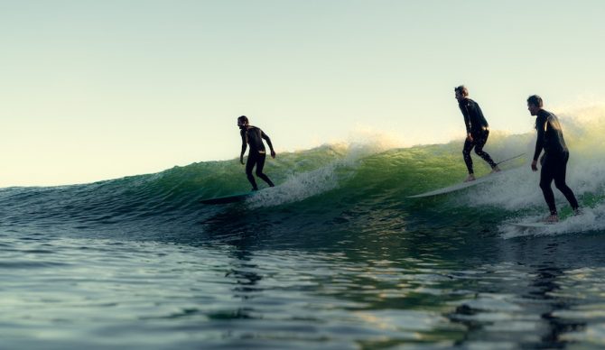 surfers party wave
