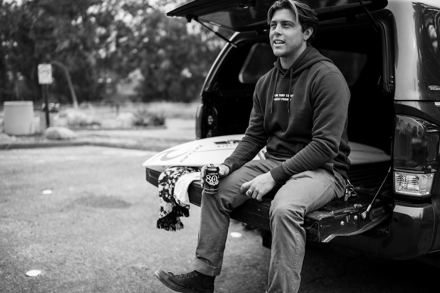 Conner Coffin sitting on the tailgate