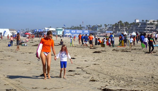 Pua walks a camper down the beach