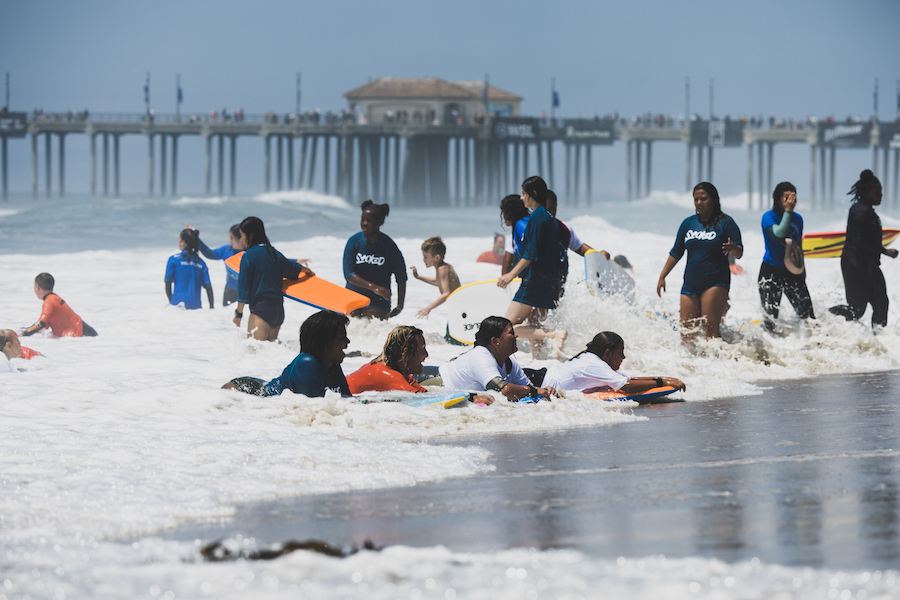 Pat rides waves with the campers